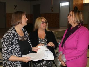Members of Mothers Against Wind Turbines, from left, Catherine Mitchell, Marianne Kidd, and Linda Rogers, discuss their appeal of a planned wind turbine project in West Niagara. ALLAN BENNER Tribune Staff