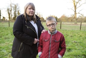 Karen Robinson with her son Ronnie Robinson (9) in the garden at Clenchwarton Hall, showing the current view. ANL-150129-112536009