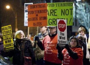 Hamilton, Ontario 29NOV10 _JLR1230.jpg Protesters against wind turbines and other causes carry signs outside Liuna Station Monday during the Liberal Trillium dinner. John Rennison, The Hamilton Spectator